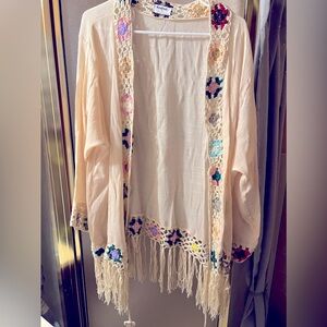 Flowing blouse with flowers & fringe.